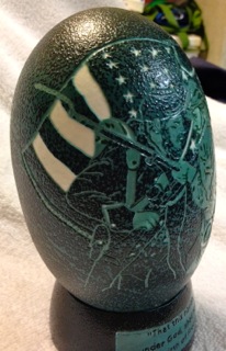 "Brother Against Brother" - An Emu egg carved by Katy Wilson