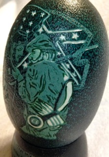 "Brother Against Brother" - An Emu egg carved by Katy Wilson
